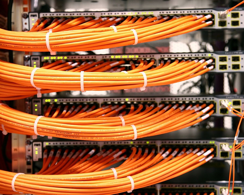Bundled ethernet cables connected to rack servers in a data center